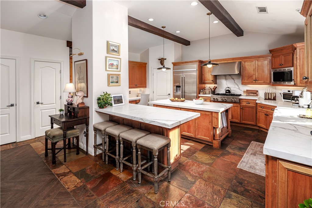6400 San Gabriel Road Atascadero, CA 93422 - Photo 5 of 50 a open kitchen with stainless steel appliances granite countertop a table chairs sink and white cabinets