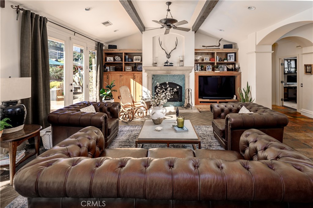 6400 San Gabriel Road Atascadero, CA 93422 - Photo 8 of 50 a living room with furniture a flat screen tv and a fireplace