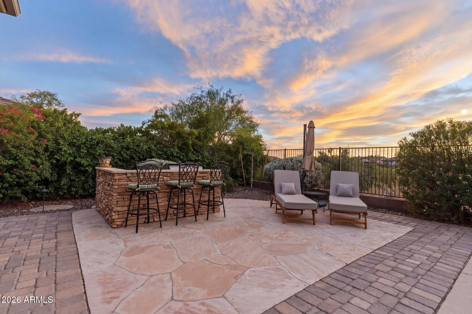 40322 North Hawk Ridge Trail Anthem, AZ 85086 - Photo 47 of 63 a view of a patio with a table and chairs
