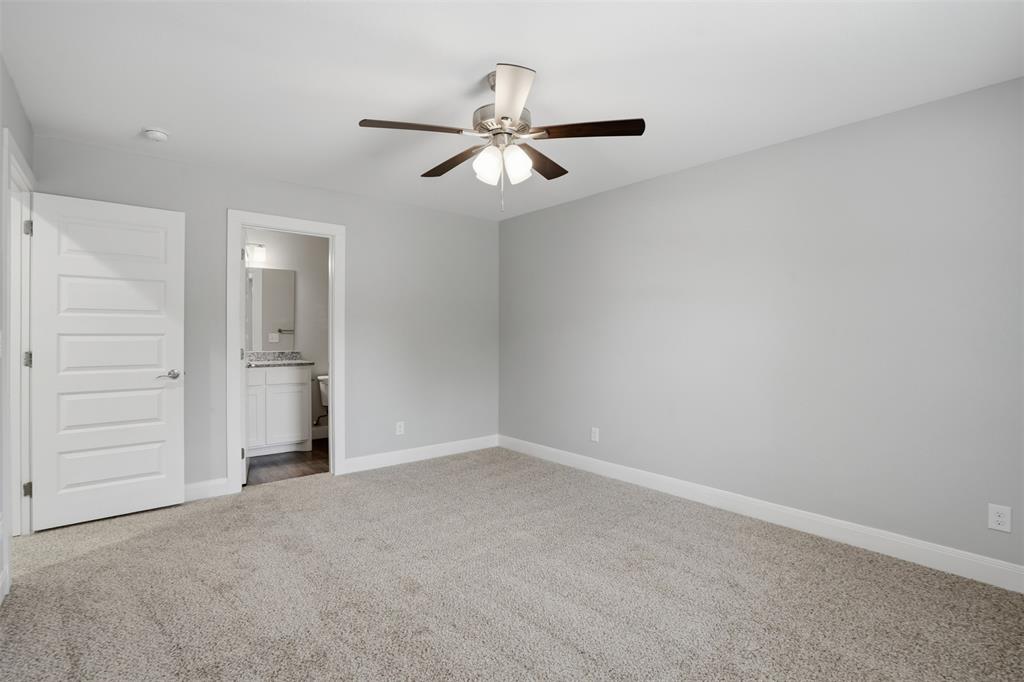 1022 West Shepherd Street, Unit 1022 Denison, TX 75020 - Photo 14 of 27 an empty room with closet and windows