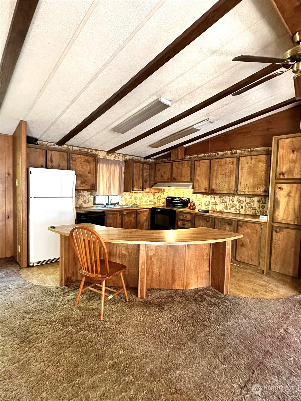 5656 Starry Road Bellingham, WA 98226 - Photo 22 of 25 a kitchen with stainless steel appliances granite countertop a stove and a refrigerator