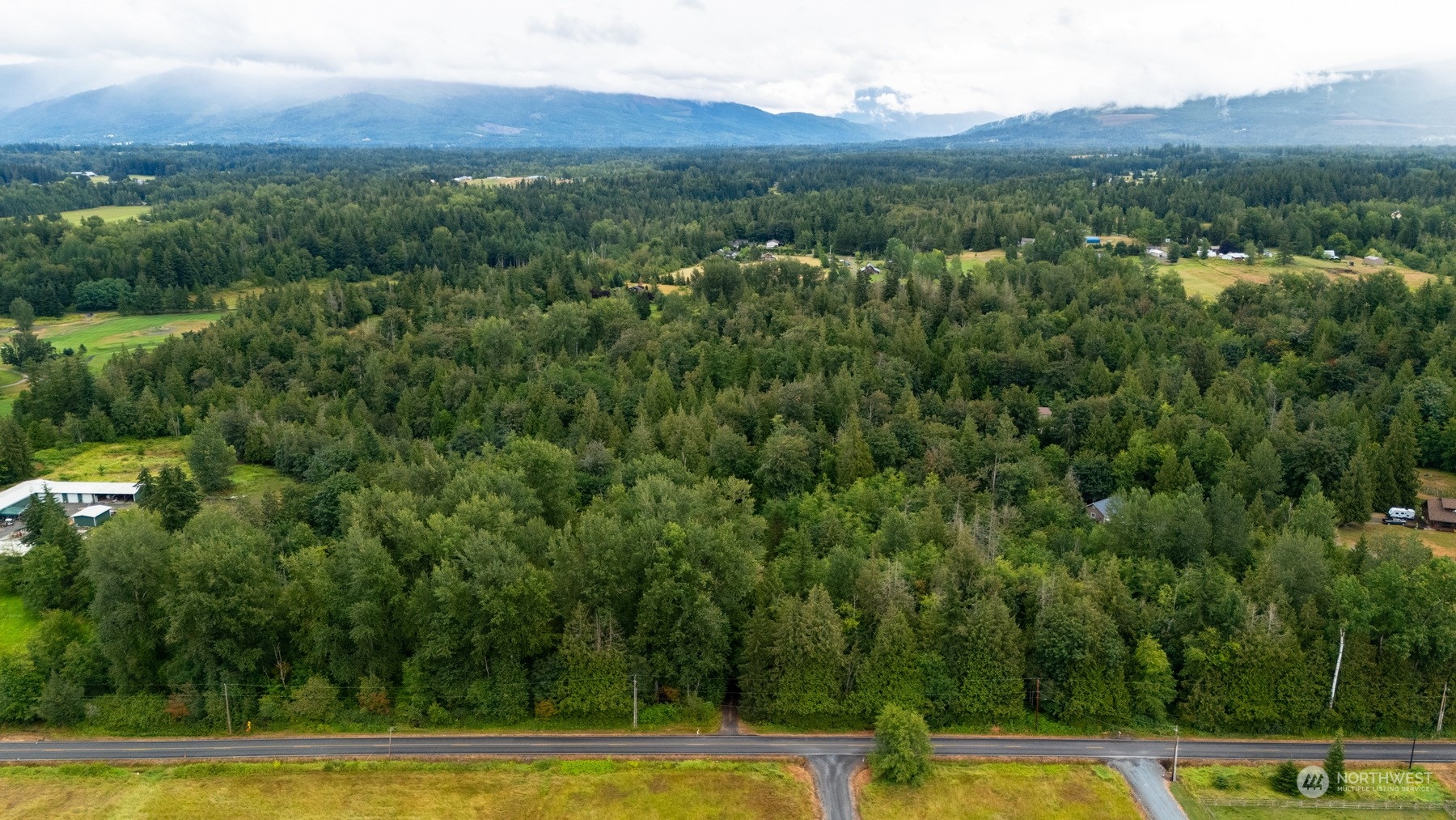 5656 Starry Road Bellingham, WA 98226 - Photo 10 of 25 a view of a swimming pool with mountains in the background