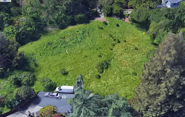 an outdoor space with lots of green space