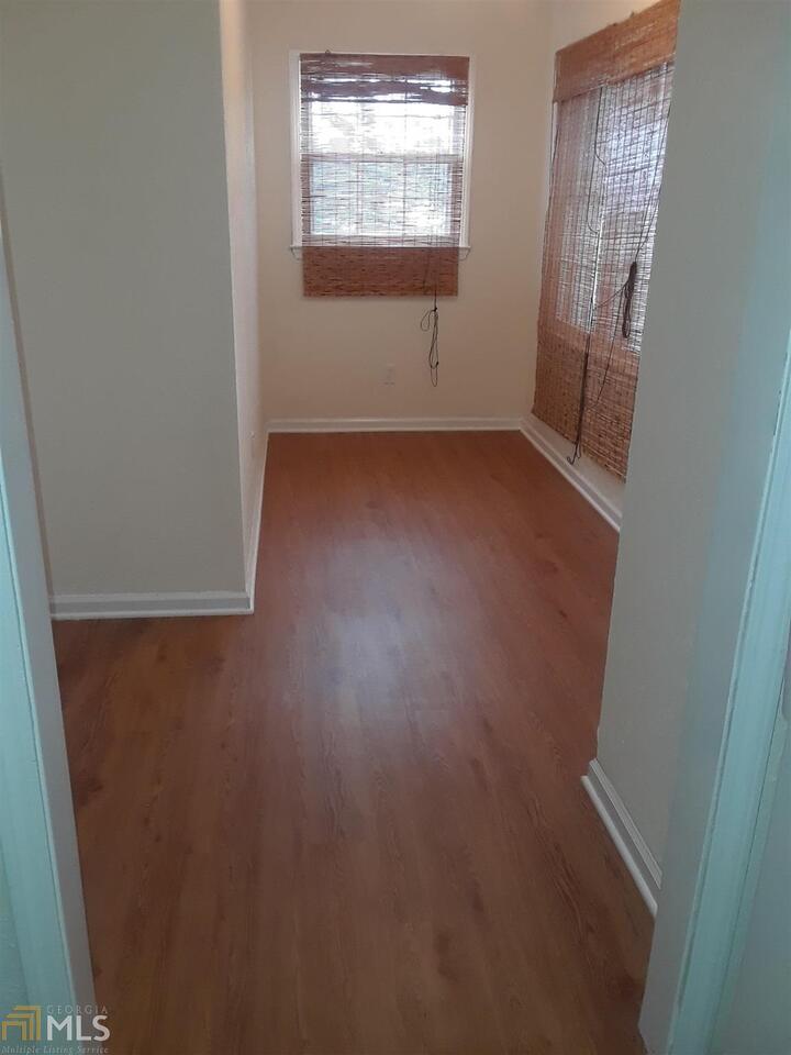 995 Green Street Southeast, Unit C Conyers, GA 30012 - Photo 15 of 29 an empty room with windows