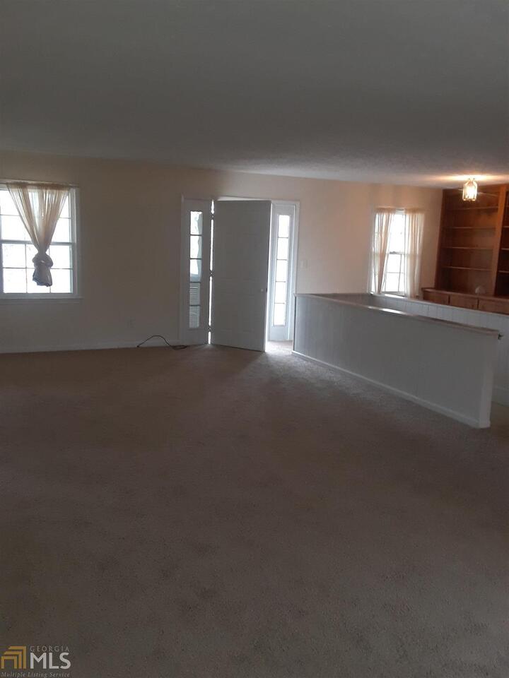 995 Green Street Southeast, Unit C Conyers, GA 30012 - Photo 23 of 29 a view of empty room with window