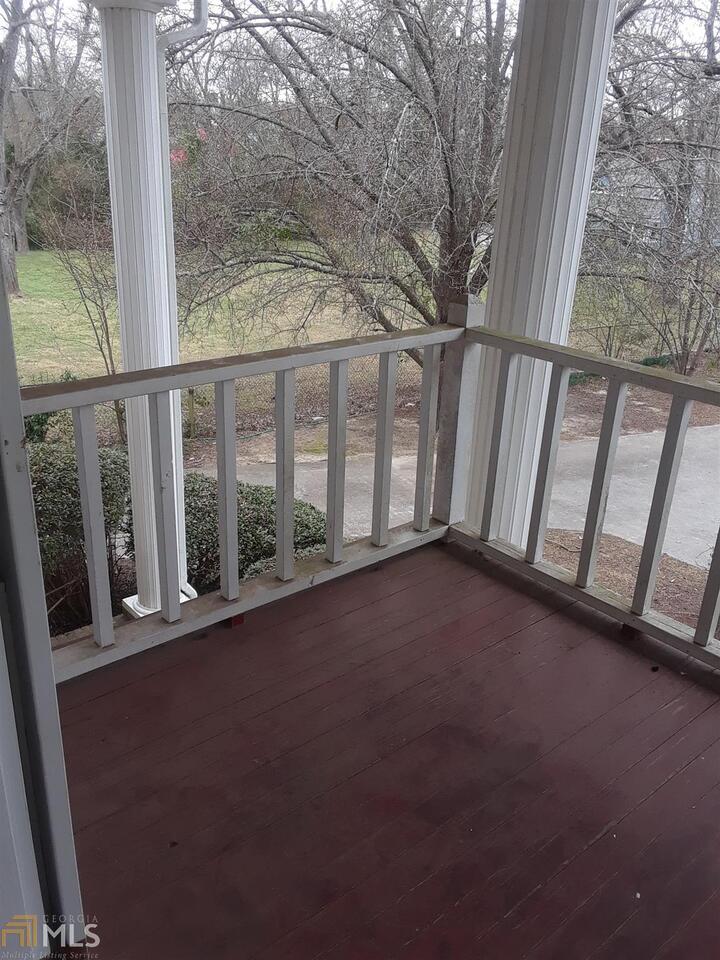 995 Green Street Southeast, Unit C Conyers, GA 30012 - Photo 25 of 29 a view of a porch with a yard