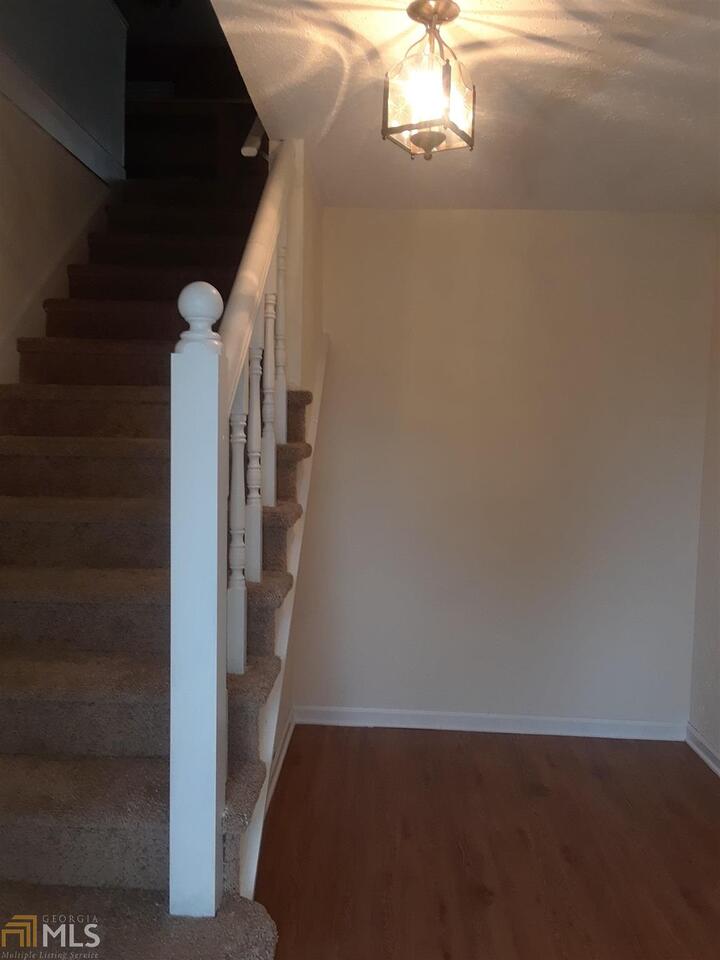 995 Green Street Southeast, Unit C Conyers, GA 30012 - Photo 3 of 29 a view of a livingroom with stairs