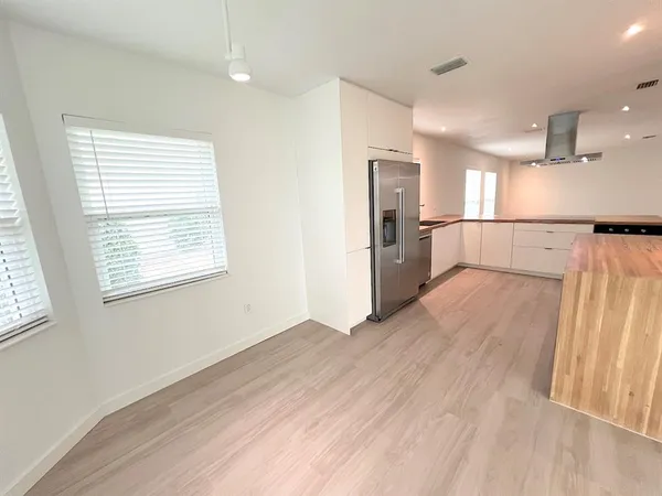 a view of a bathroom from a hallway