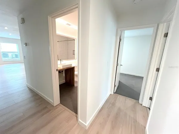 a bathroom with a sink toilet and mirror