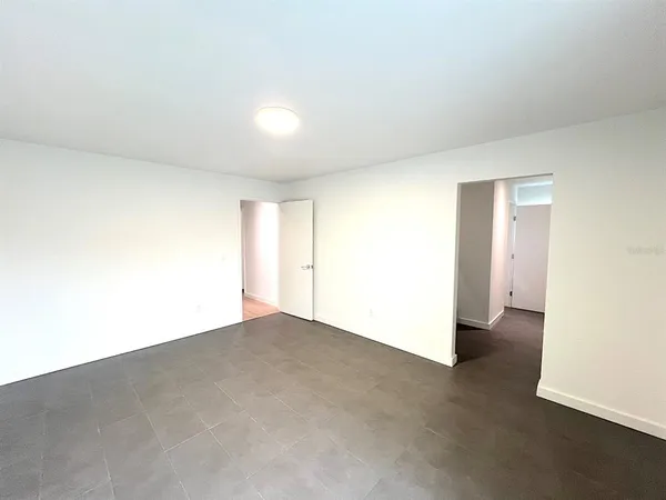 a view of a hallway to an empty room