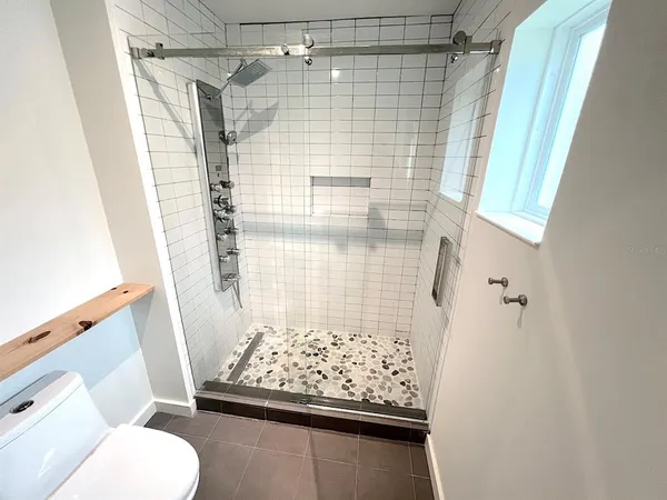 an empty room with a empty space and windows