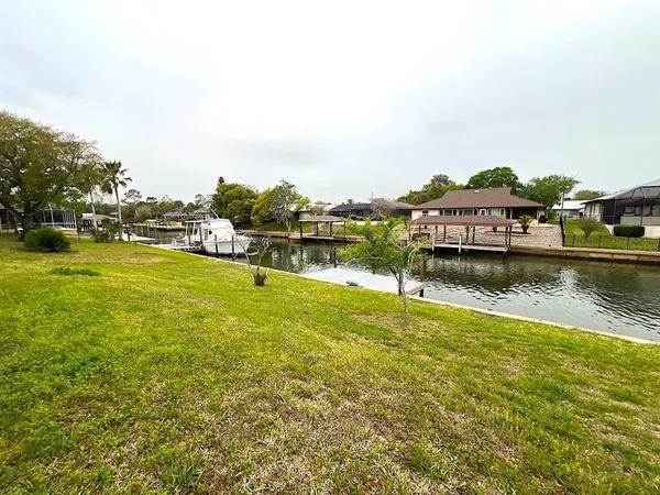 an aerial view of a house with a swimming pool yard and outdoor seating