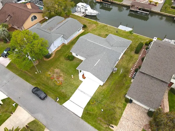 a view of a room with wooden floor and a window