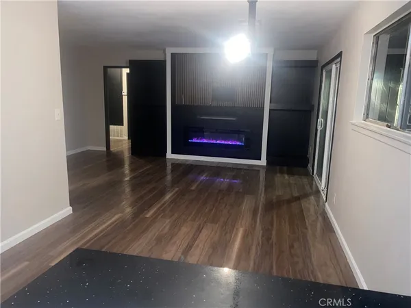 a view of hallway with wooden floor