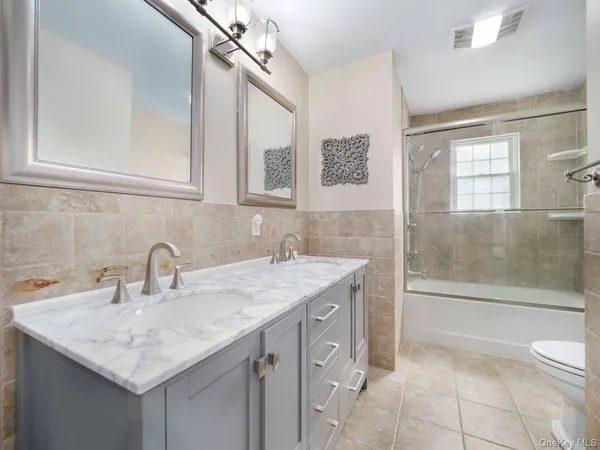a close view of a utility room with dryer and washer