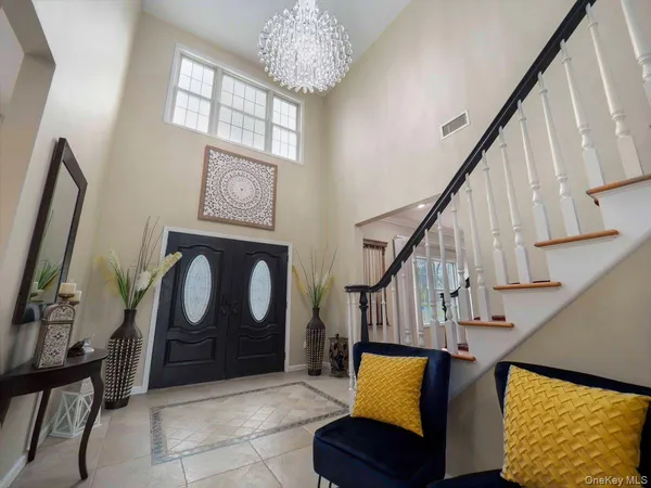 a front view of a house with wooden floor and windows