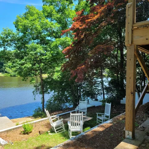 a view of a lake with houses in the back