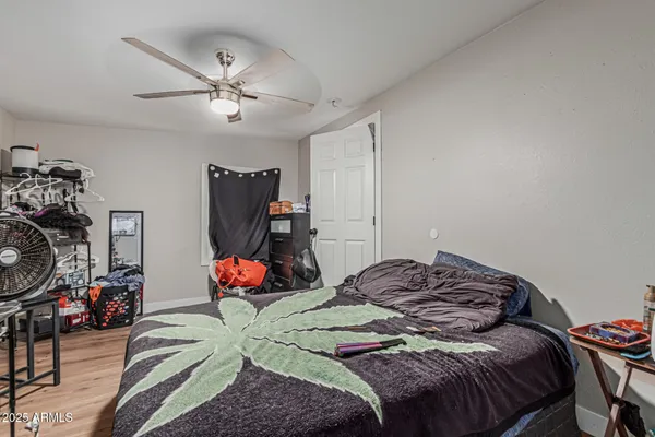 a bedroom with a bed and dresser