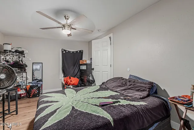 a bedroom with a bed and dresser