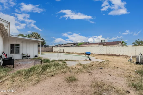 a view of a backyard of the house