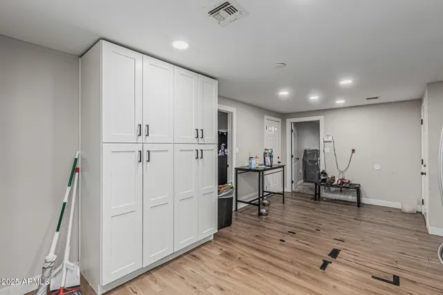 a view of kitchen with furniture and wooden floor