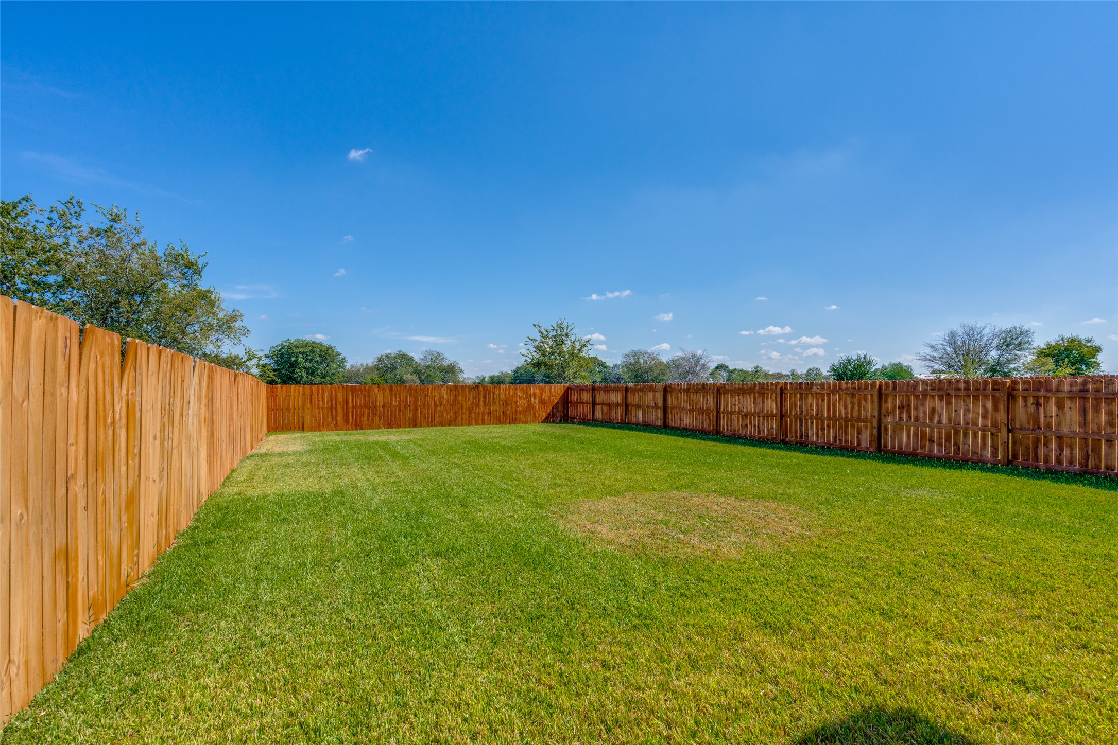 331 Navarro Way, Unit 26B Seguin, TX 78155 - Photo 2 of 8 a view of a yard with wooden fence