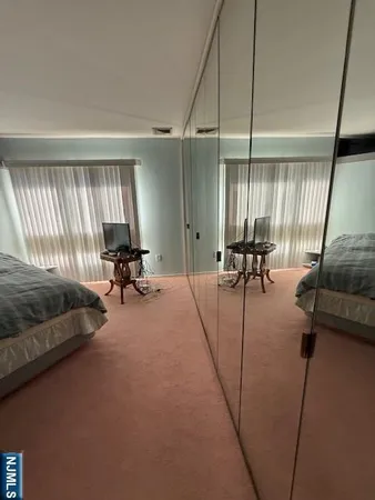 a bathroom with a tub a toilet and a shower