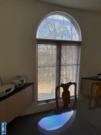 a room with water heater and a window