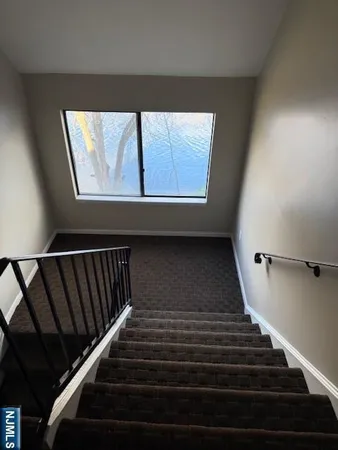 a view of a balcony with wooden floor