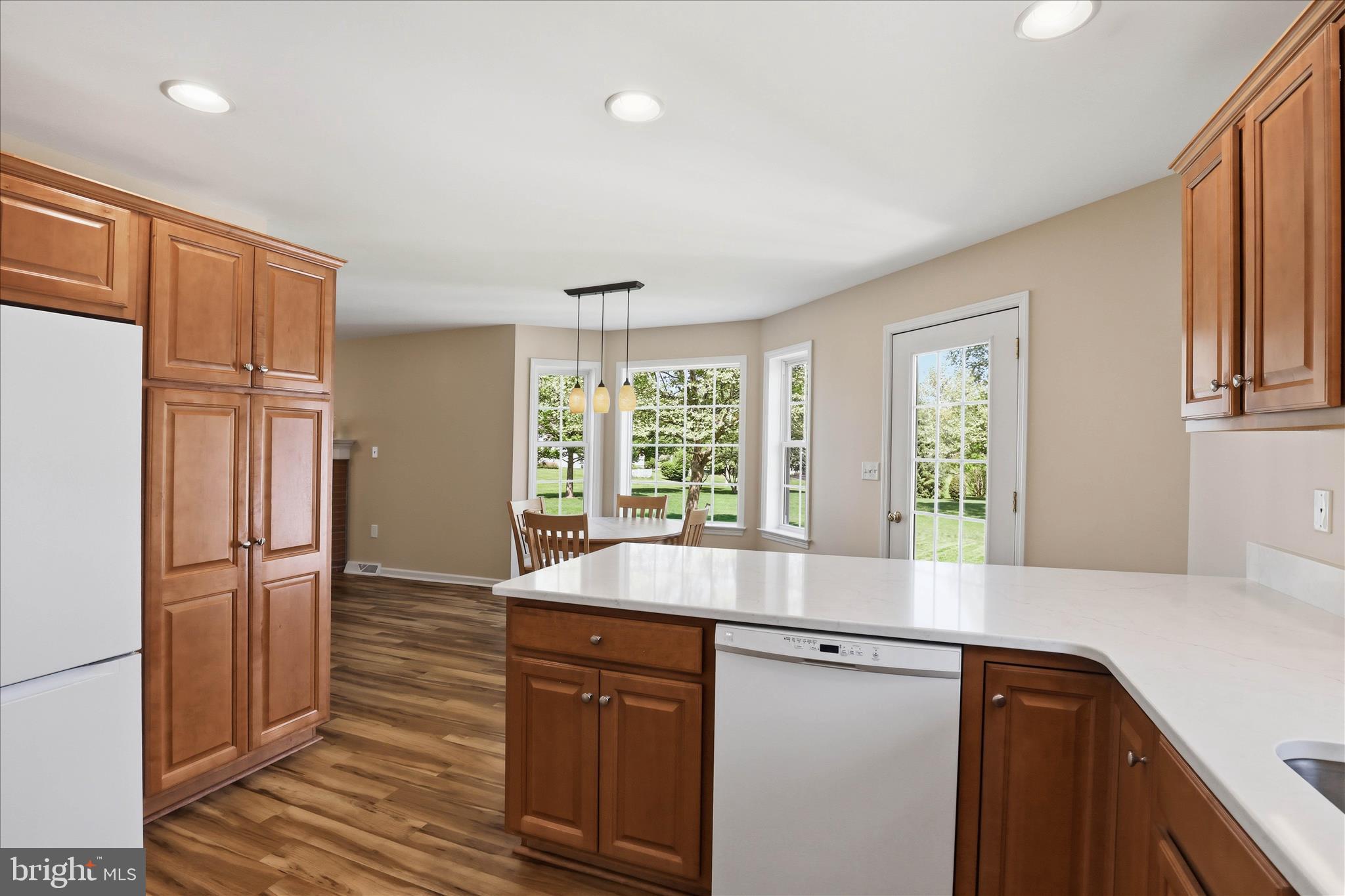 533 Thornberry Lane Lititz, PA 17543 - Photo 14 of 56 a view kitchen with granite countertop a sink and dishwasher with wooden floor