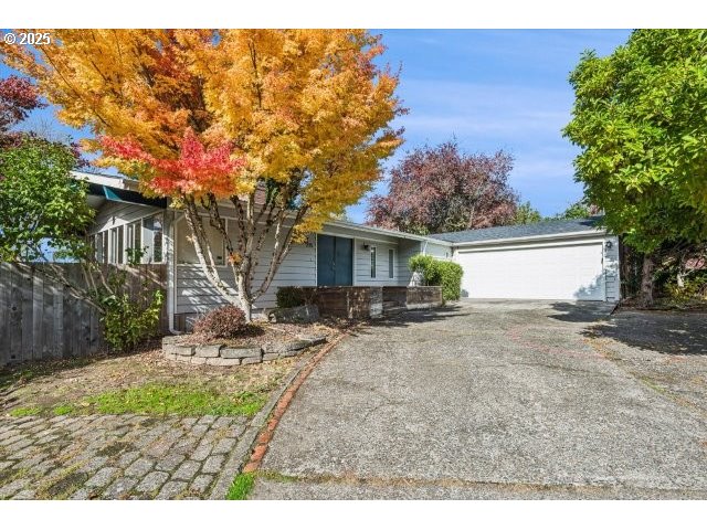 215 Southwest Towle Avenue Gresham, OR 97080 - Photo 1 of 38 a view of a house with a backyard and a tree