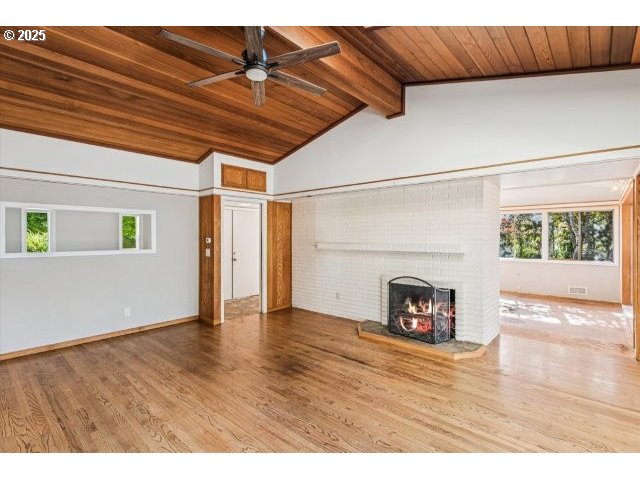 215 Southwest Towle Avenue Gresham, OR 97080 - Photo 12 of 38 a view of an empty room with wooden floor and a window