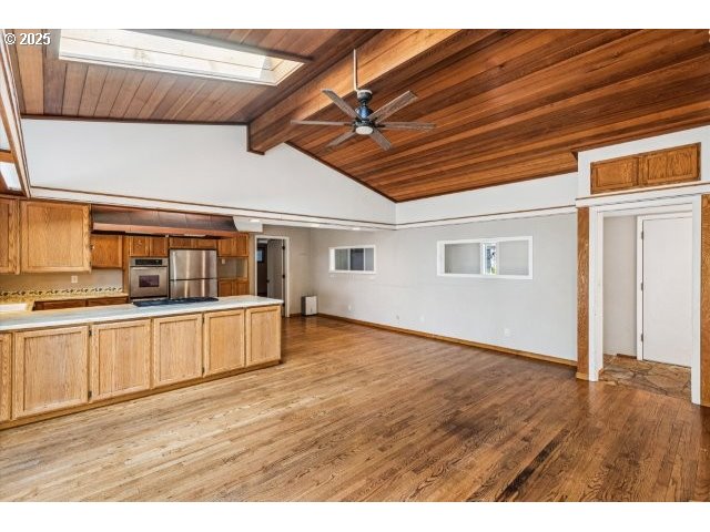 215 Southwest Towle Avenue Gresham, OR 97080 - Photo 13 of 38 a view of a kitchen with wooden floor