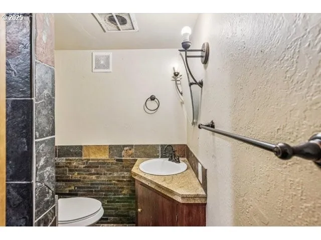 a bathroom with a sink and mirror