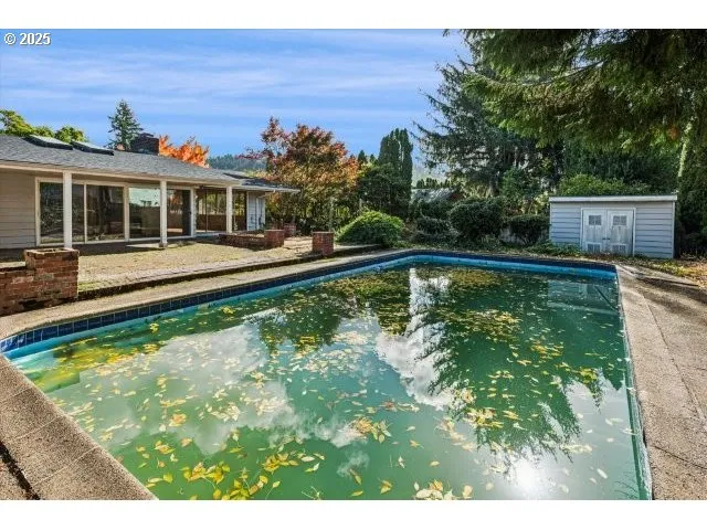 a view of a swimming pool with a patio