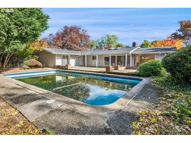 a view of a house with swimming pool