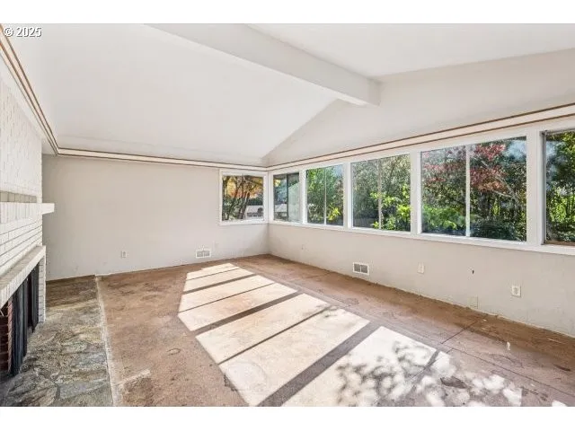 a view of an empty room and window