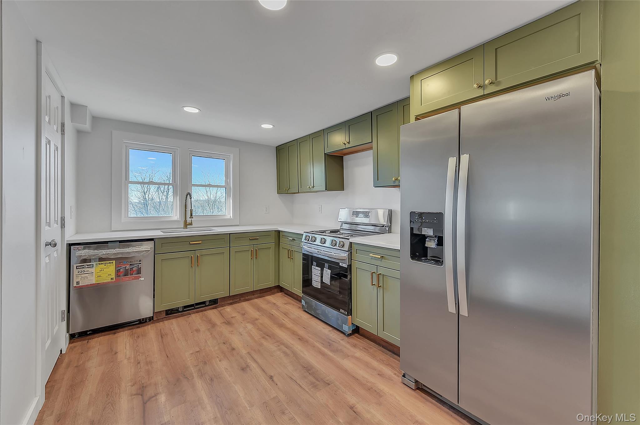 67 Jacobs Road Westtown, NY 10998 - Photo 9 of 35 Kitchen featuring green cabinets, stainless steel appliances, light wood finished floors, and recessed lighting