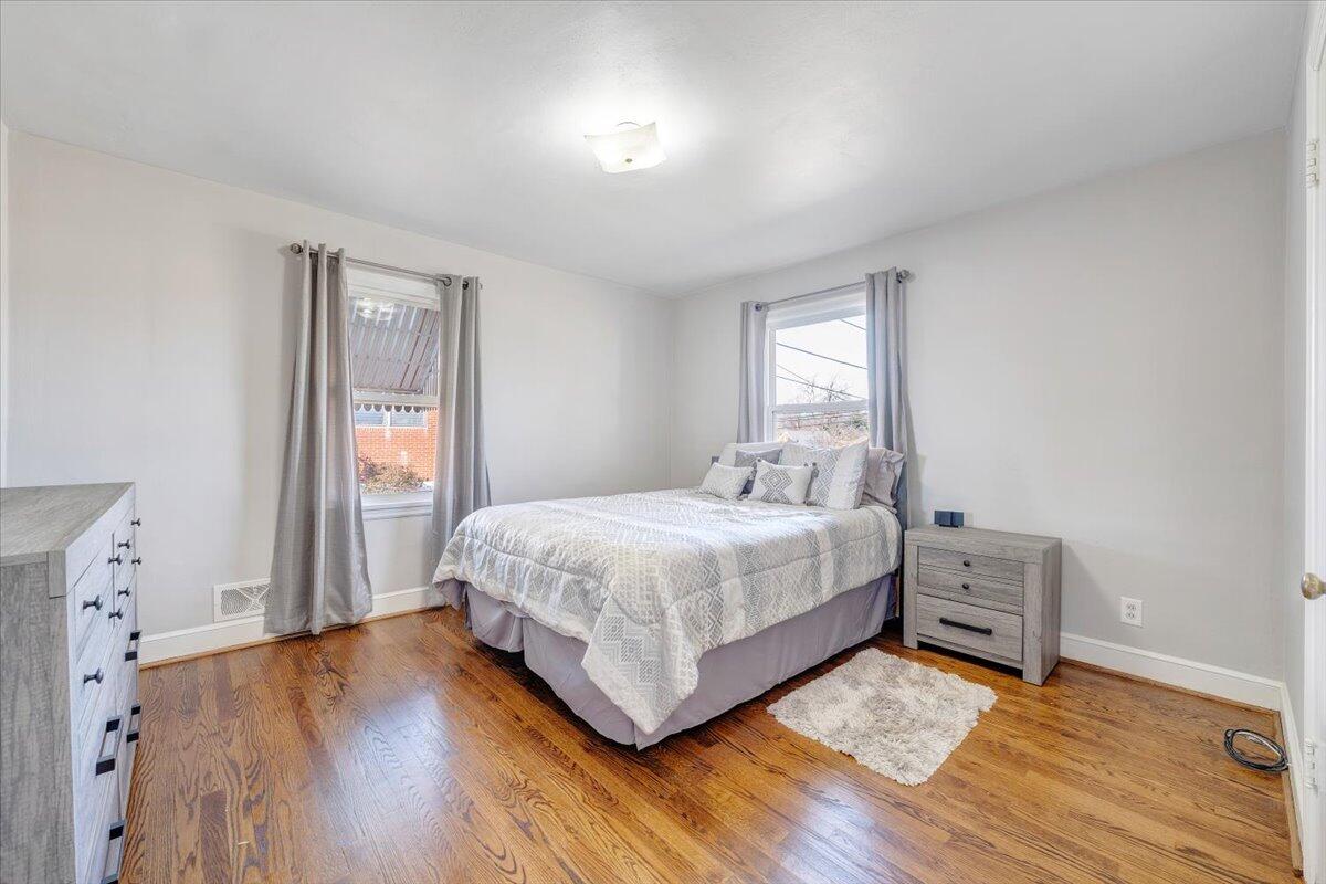 3808 Cove Road Roanoke, VA 24017 - Photo 15 of 34 a bedroom with a bed and a window