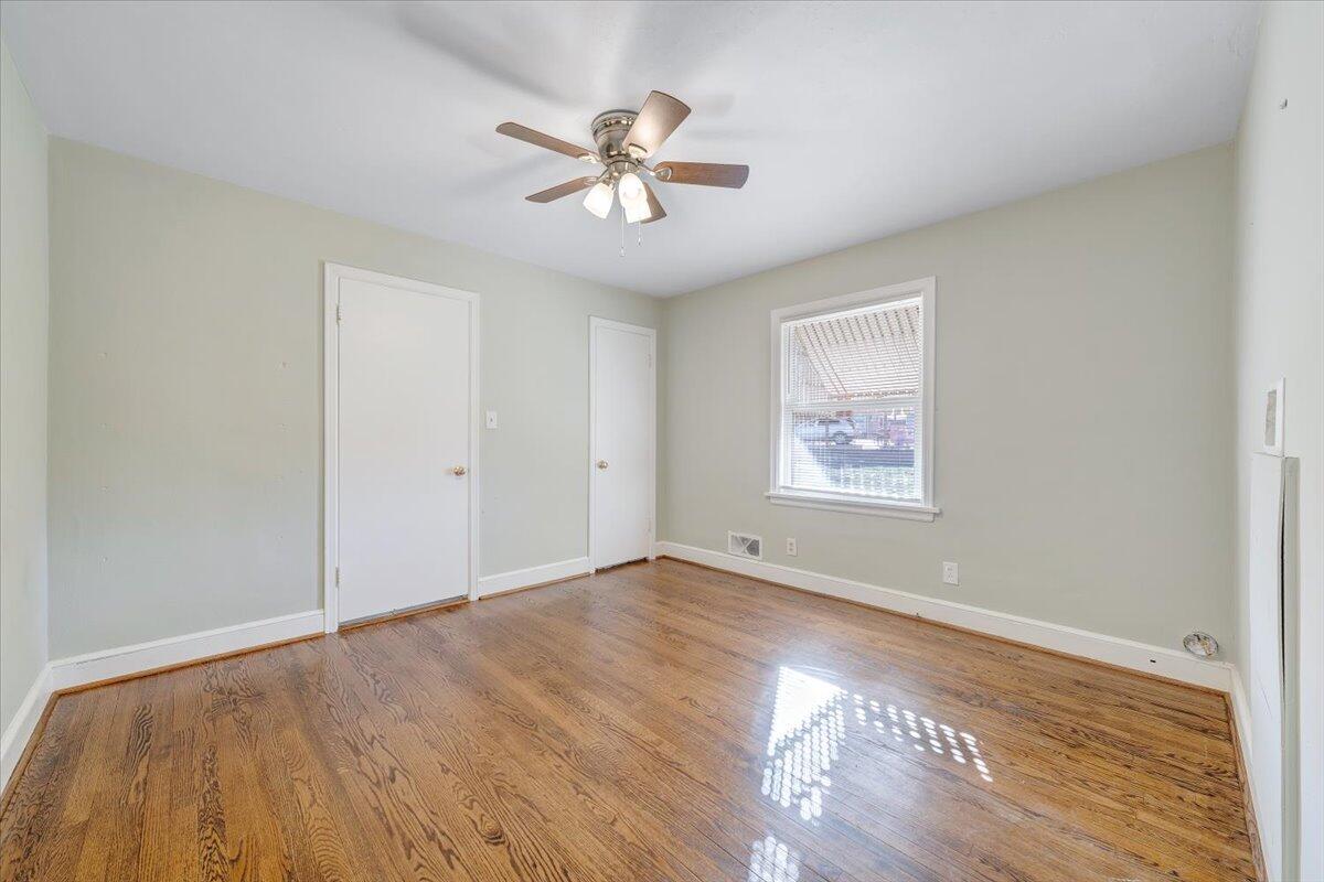 3808 Cove Road Roanoke, VA 24017 - Photo 17 of 34 a view of empty room with wooden floor and fan