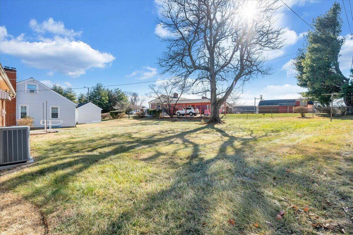 3808 Cove Road Roanoke, VA 24017 - Photo 28 of 34 a view of yard with swimming pool and trees