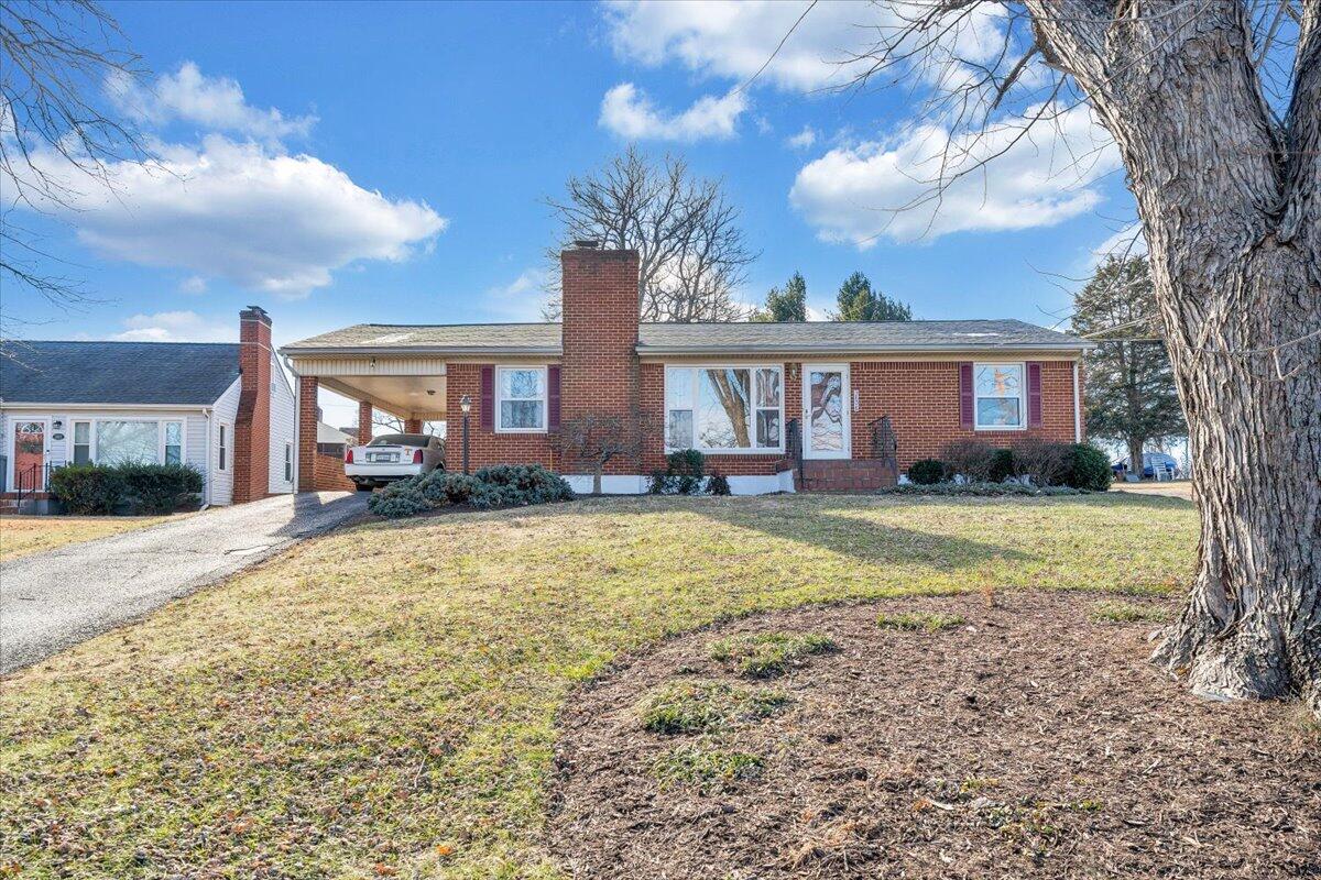 3808 Cove Road Roanoke, VA 24017 - Photo 30 of 34 a view of a house with a yard and pathway