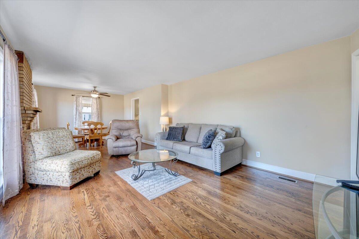 3808 Cove Road Roanoke, VA 24017 - Photo 3 of 34 a living room with couches and a night stand