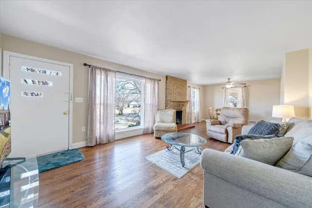 a view of a house with backyard and porch