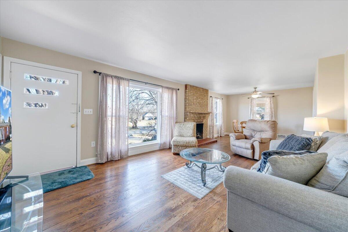 3808 Cove Road Roanoke, VA 24017 - Photo 4 of 34 a living room with furniture and wooden floor