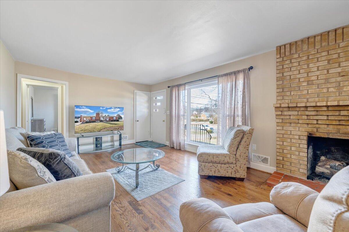 3808 Cove Road Roanoke, VA 24017 - Photo 5 of 34 a living room with furniture or couch and a fireplace