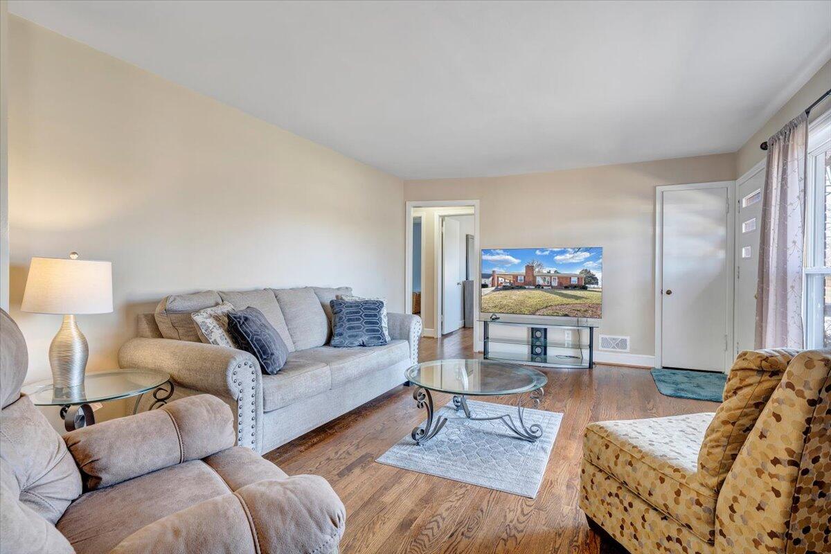 3808 Cove Road Roanoke, VA 24017 - Photo 7 of 34 a living room with furniture and wooden floor
