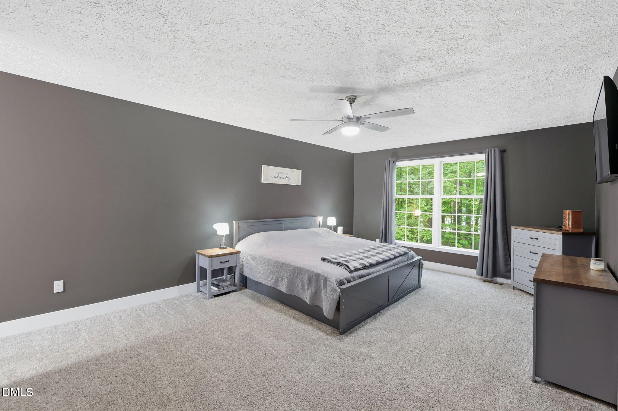 1925 Old Allensville Road Roxboro, NC 27574 - Photo 49 of 58 a spacious bedroom with a bed and a large window