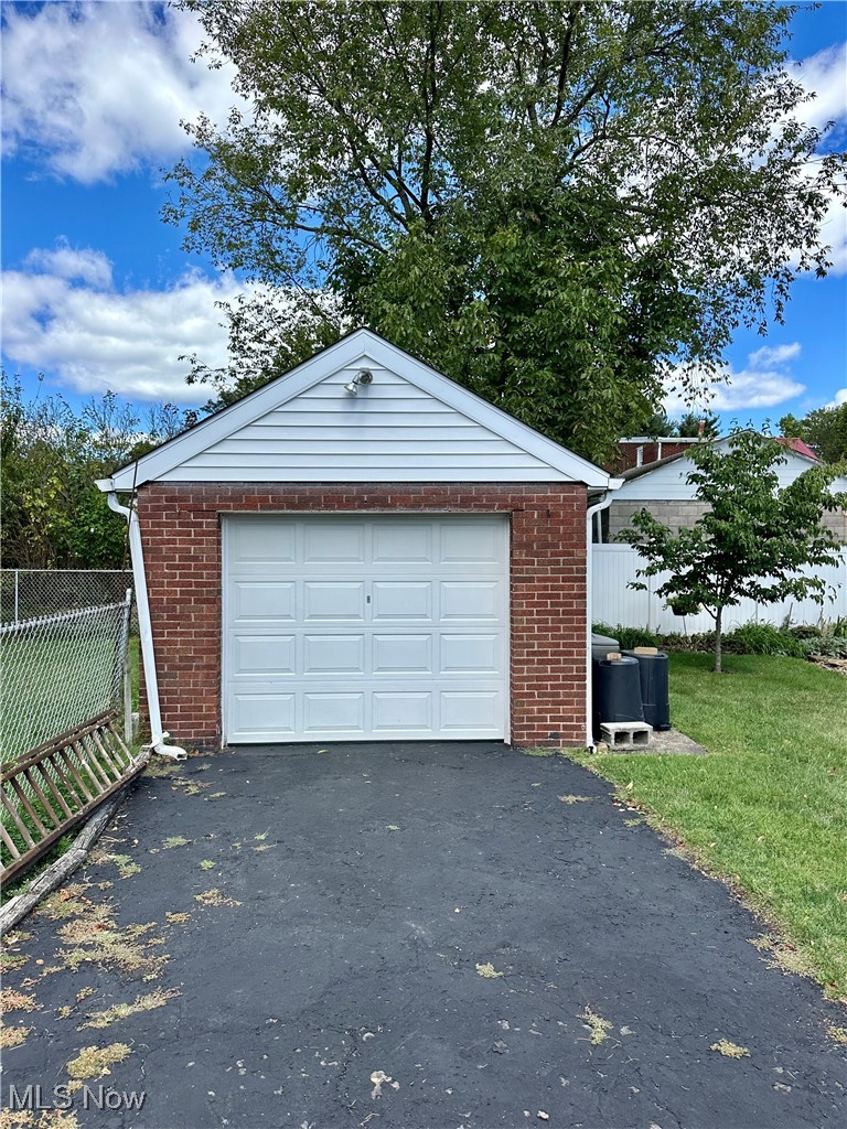 343 Raleigh Avenue Weirton, WV 26062 - Photo 44 of 46 Garage featuring a lawn