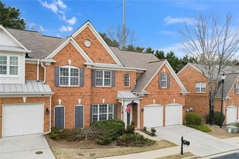 a large kitchen with stainless steel appliances granite countertop a sink stove and refrigerator